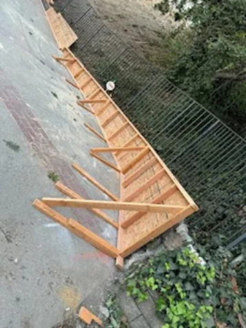 Wooden deck or pergola framework photographed from overhead